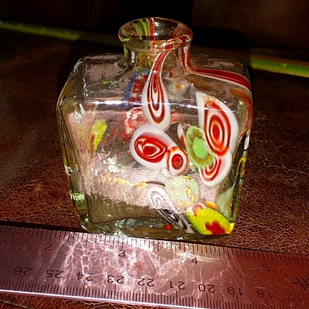 small bottle that hold scented sticks